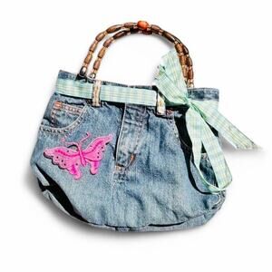 Handmade Vintage Denim Clutch. Butterfly patch and ribbon belt.